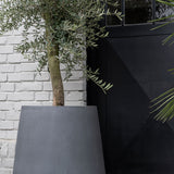 Pax Fiberstone Grau planter by Pottery Pots, showcasing a modern gray design with a textured finish.
