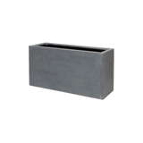 Jort Fiberstone Grau planter by Pottery Pots, showcasing a sleek gray finish and modern design for indoor or outdoor use.