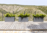 Gray Jort Fiberstone planter by Pottery Pots, showcasing a sleek, modern design with a textured finish.