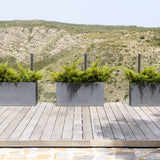 Gray Jort Fiberstone planter by Pottery Pots, showcasing a sleek, modern design with a textured finish.